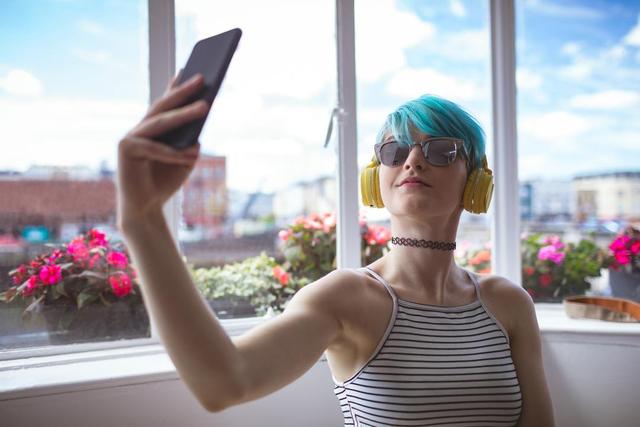 Stylish woman taking selfie with mobile phone - Download Free Stock Photos Pikwizard.com