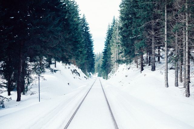 a train track in the snow - Download Free Stock Photos Pikwizard.com