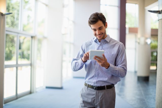 Businessman using digital tablet at conference centre