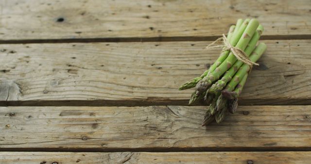 Image of fresh asparagus bundle on wooden background - Download Free Stock Photos Pikwizard.com