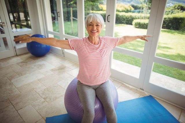 African american mid adult woman practicing yoga during online