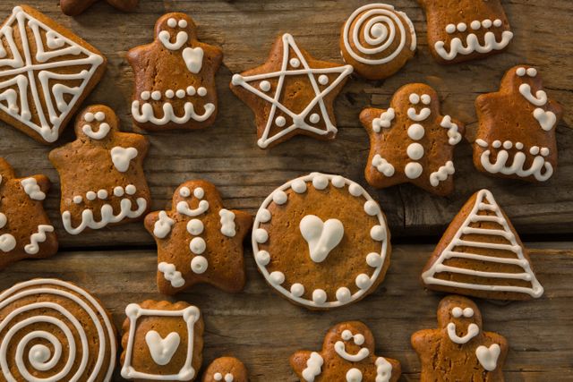 Overhead view of various ginger bread cookies on wooden table