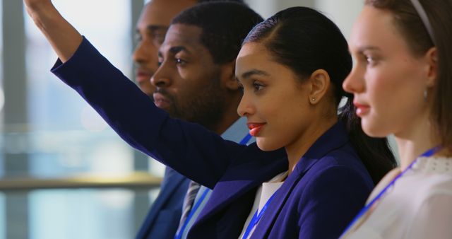 Side view of a beautiful mixed-race businesswoman raising hand and asking a question in the business seminar 4k