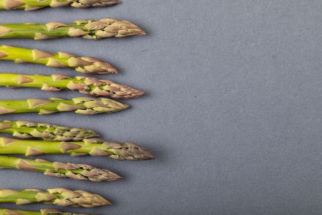 Overhead view of asparagus on gray background, copy space - Download Free Stock Photos Pikwizard.com