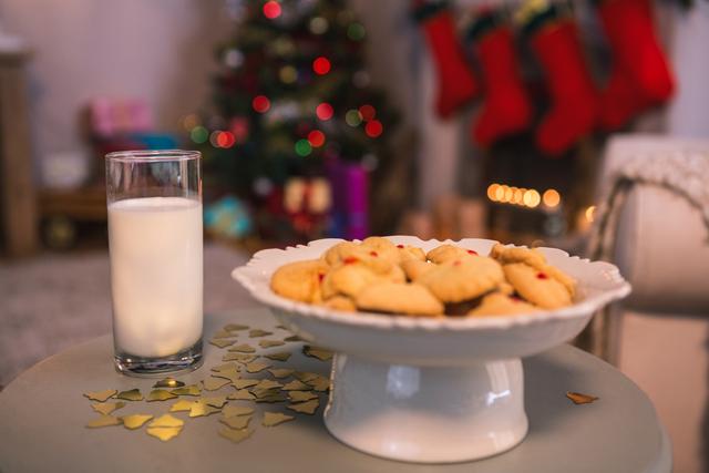 Christmas cookies on plate with a glass of milk - Download Free Stock Photos Pikwizard.com