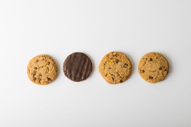 Directly above shot of cookies arranged over white background with copy space. unaltered, food, studio shot and snack.