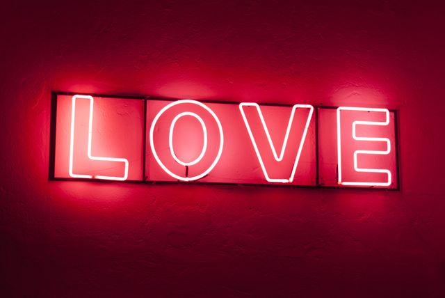 a neon sign that says love - Download Free Stock Photos Pikwizard.com
